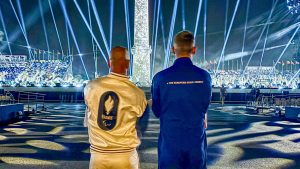 The two flag bearers watching the Paralympics opening ceremony taken from behind - John McFall is on the right