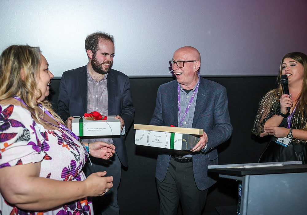 Me at the Dimensions Learning Disability and Autism Leaders List Awards in April 2024 with presenter Ken Bruce.